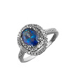 Серебряное кольцо с крупным синим фианитом в центре и россыпью белых по кругу