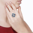 Крупное кольцо из родированного серебра с фианитами «Мистические узоры»