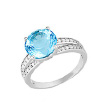 Серебряное кольцо украшенное  фианитами и голубым топазом